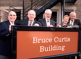 Bruce Curtis, center, helped dedicate the building named for him in 2002.