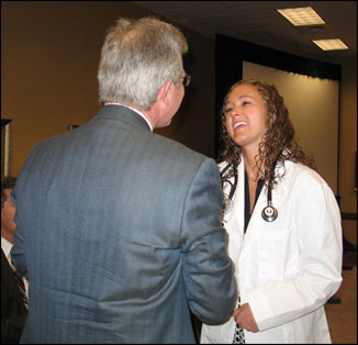 Chair of the Department of Family Medicine Frank DeGruy talks with Maggie Tillquist