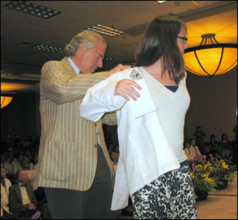 Associate Dean of Alumni Relations Bill Maniatis, MD, helps student Sarah Recktenwall-Work